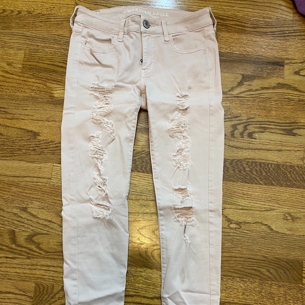 American Eagle light pink ripped jeggings